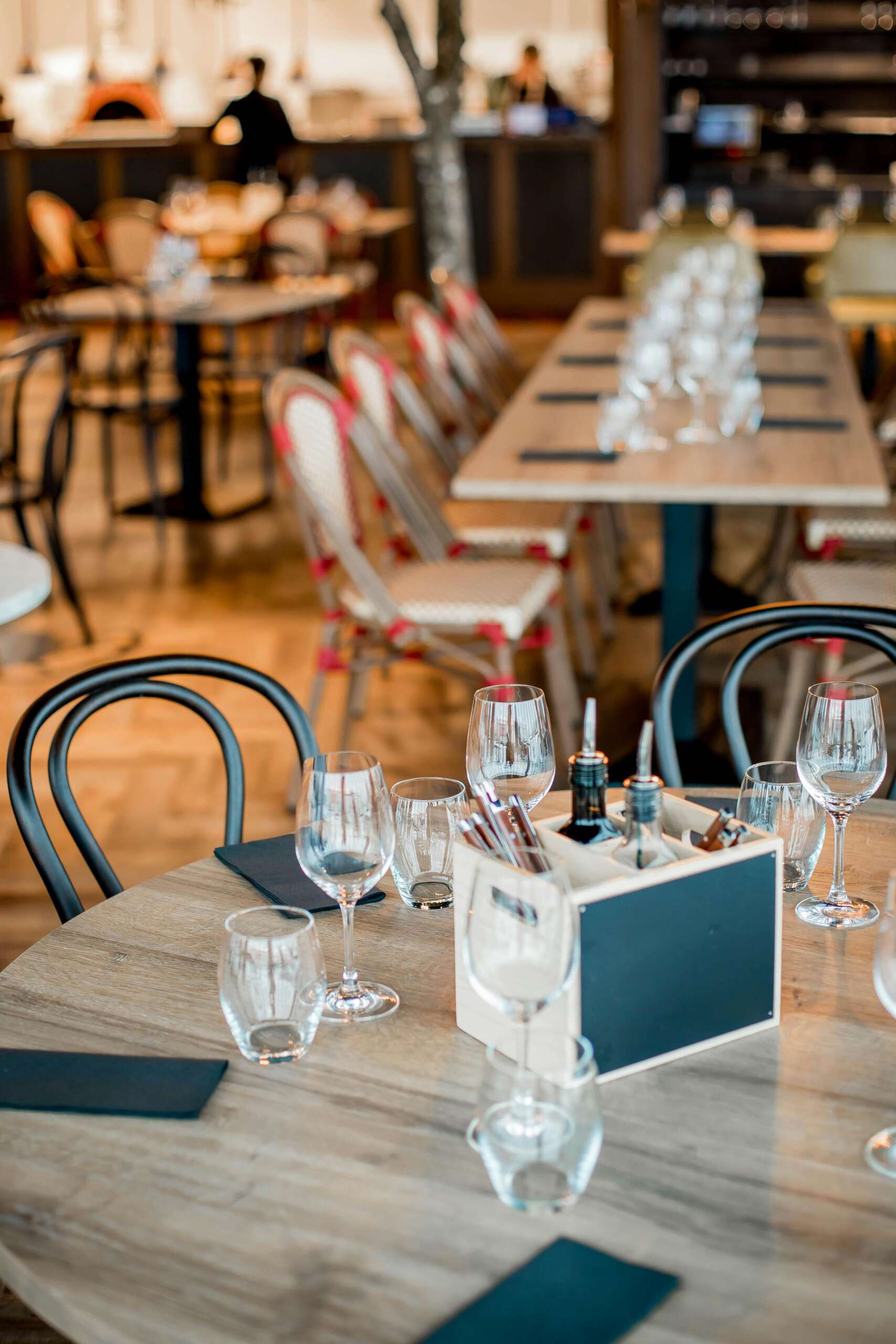 Elegant restaurant interior with neatly arranged tables ready for guests.