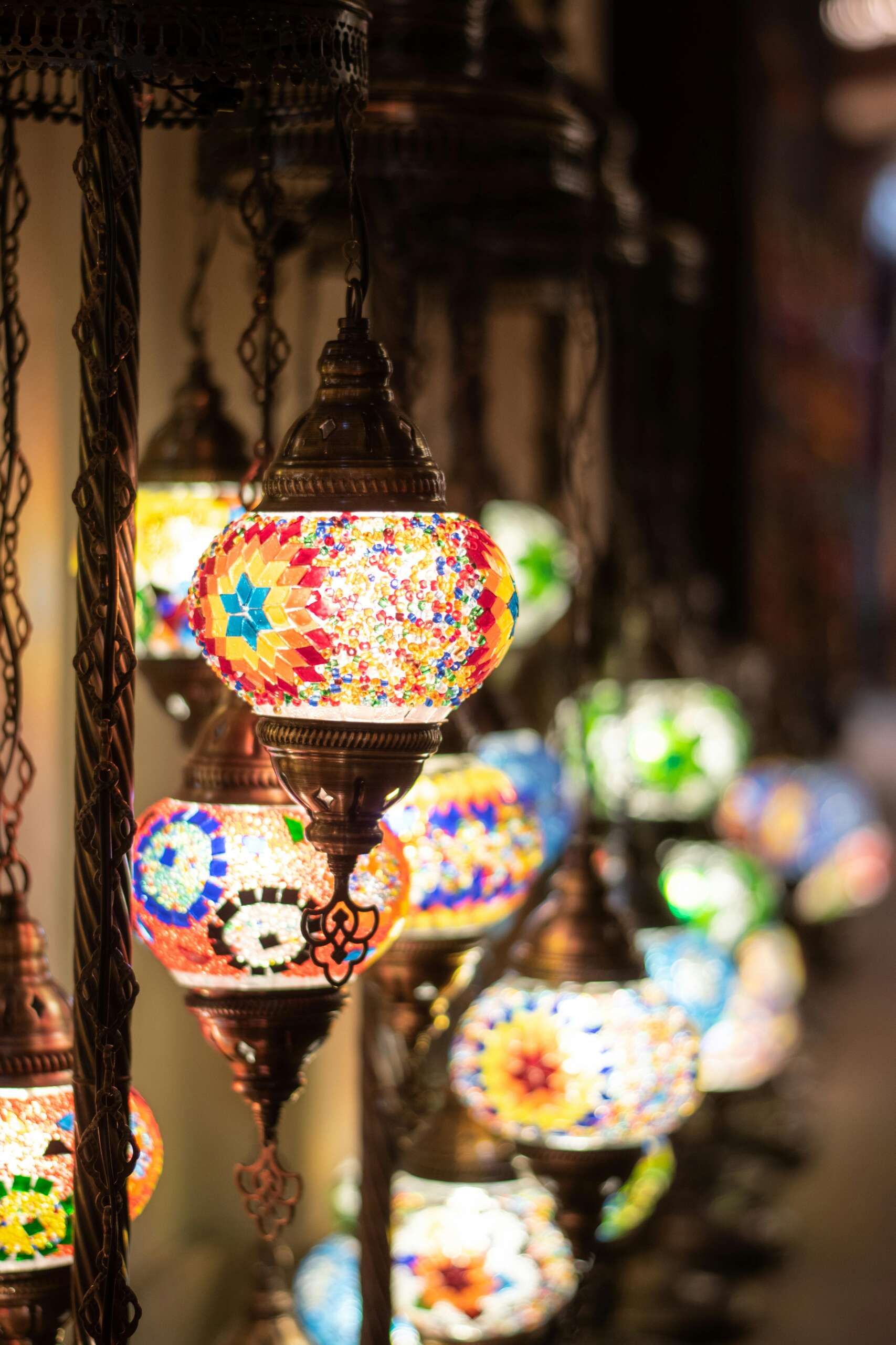 Vibrant mosaic lamps beautifully illuminate a market in Dubai, UAE.